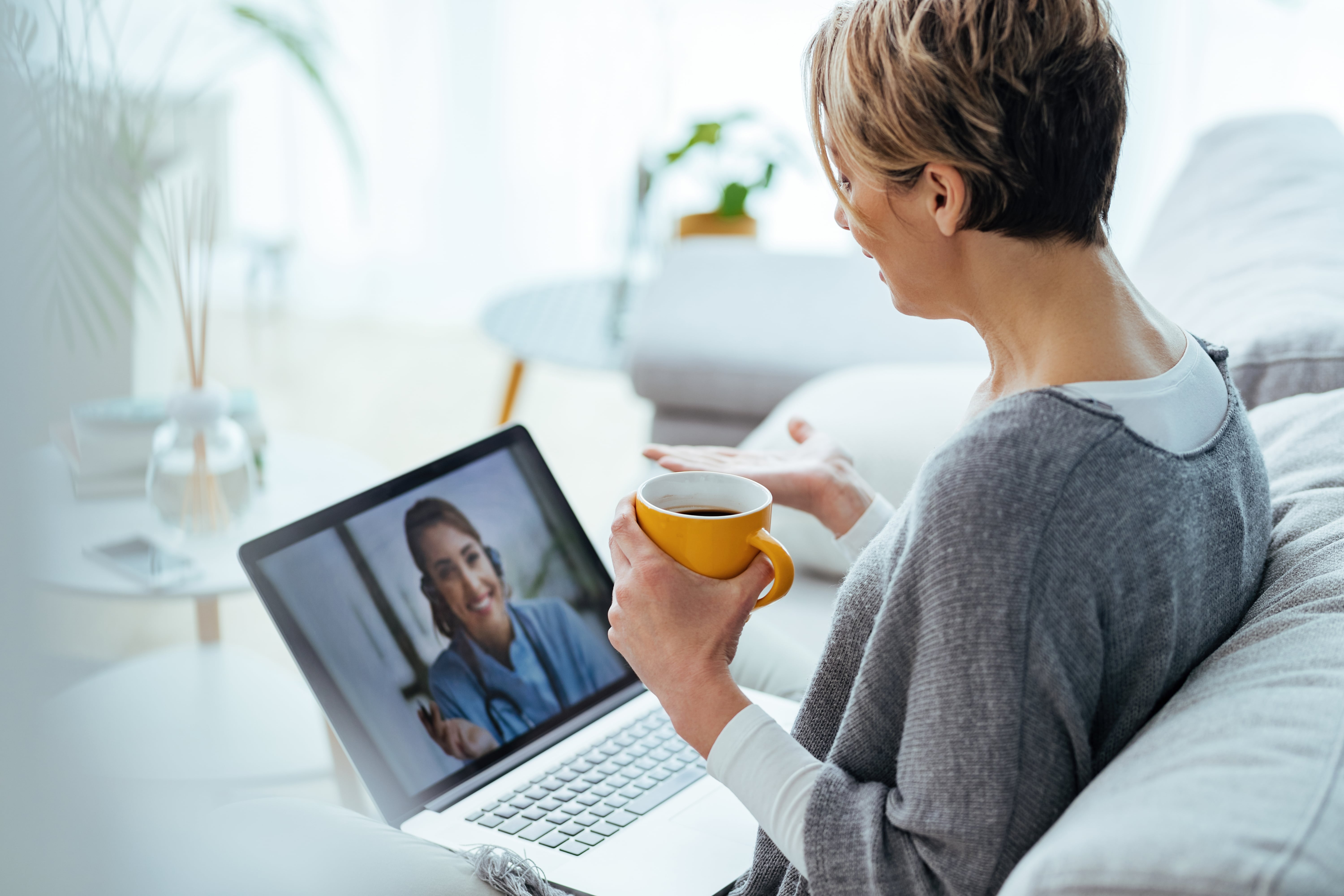Support worker explaining a phone app setup