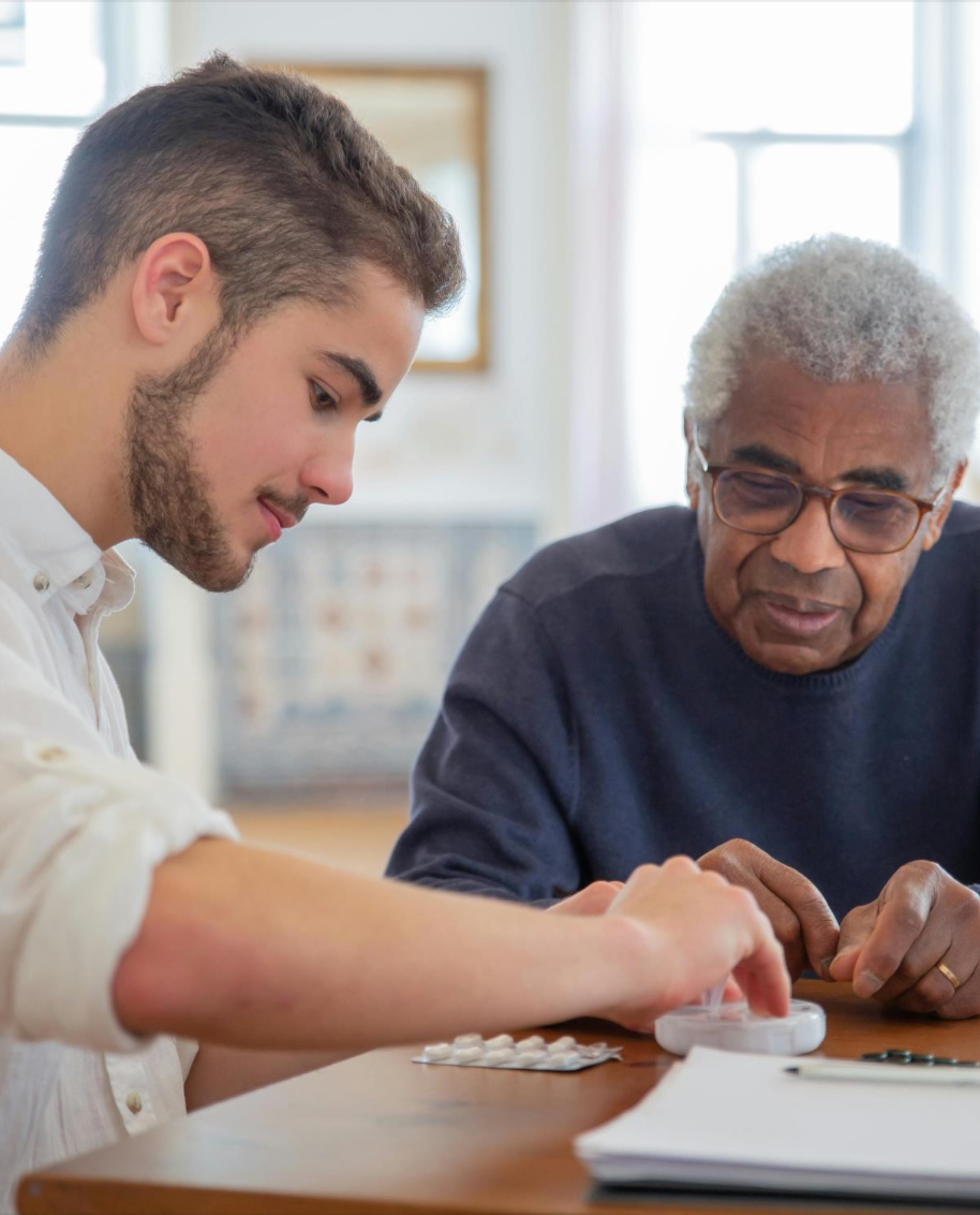 Carer and client smiling together